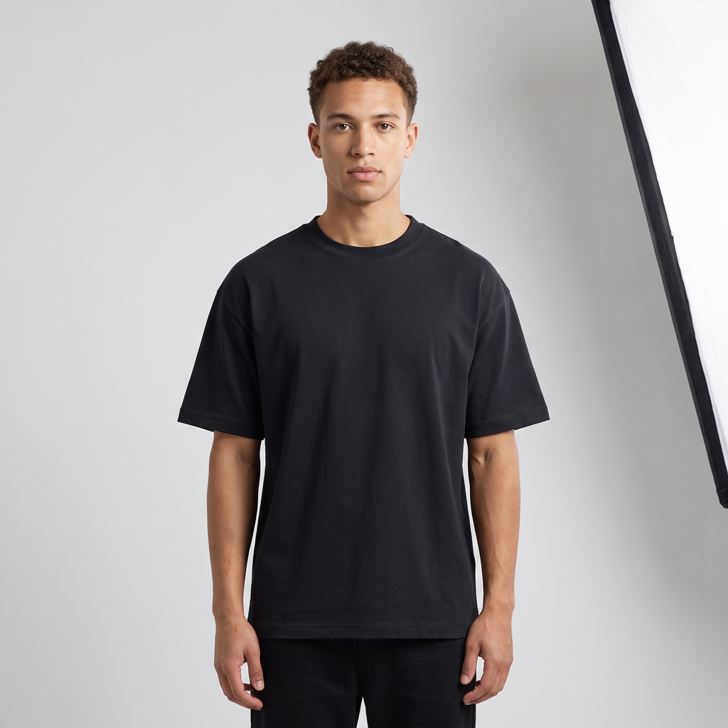 Model wearing the JUKE Unisex Drop Shoulder Cotton T-Shirt, studio shot