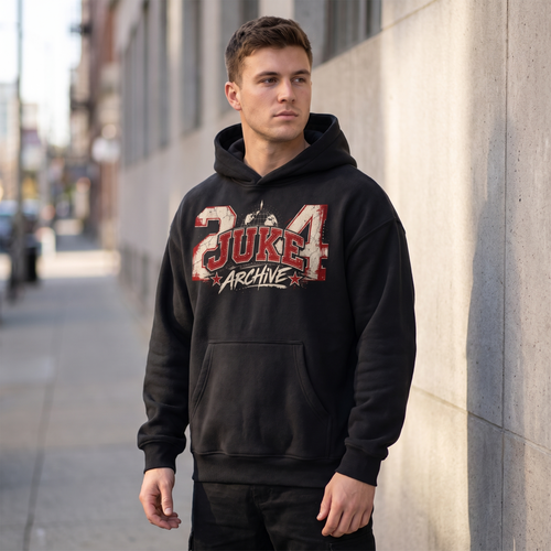 Model wearing the JUKE Essential Oversized Boxy Fit Fleece Hoodie on a city street