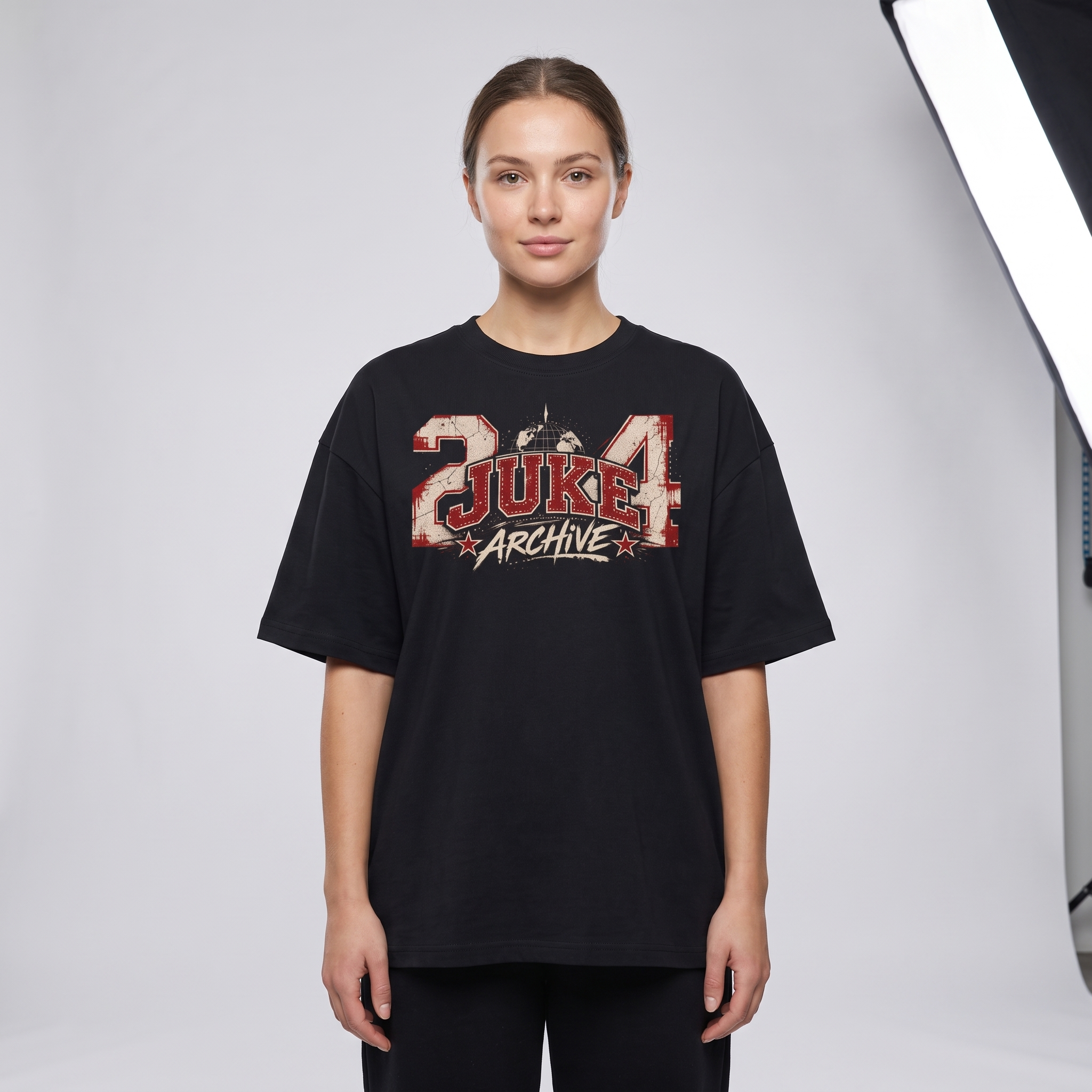 Model wearing the JUKE Unisex Oversized Drop Shoulder T-Shirt, studio shot