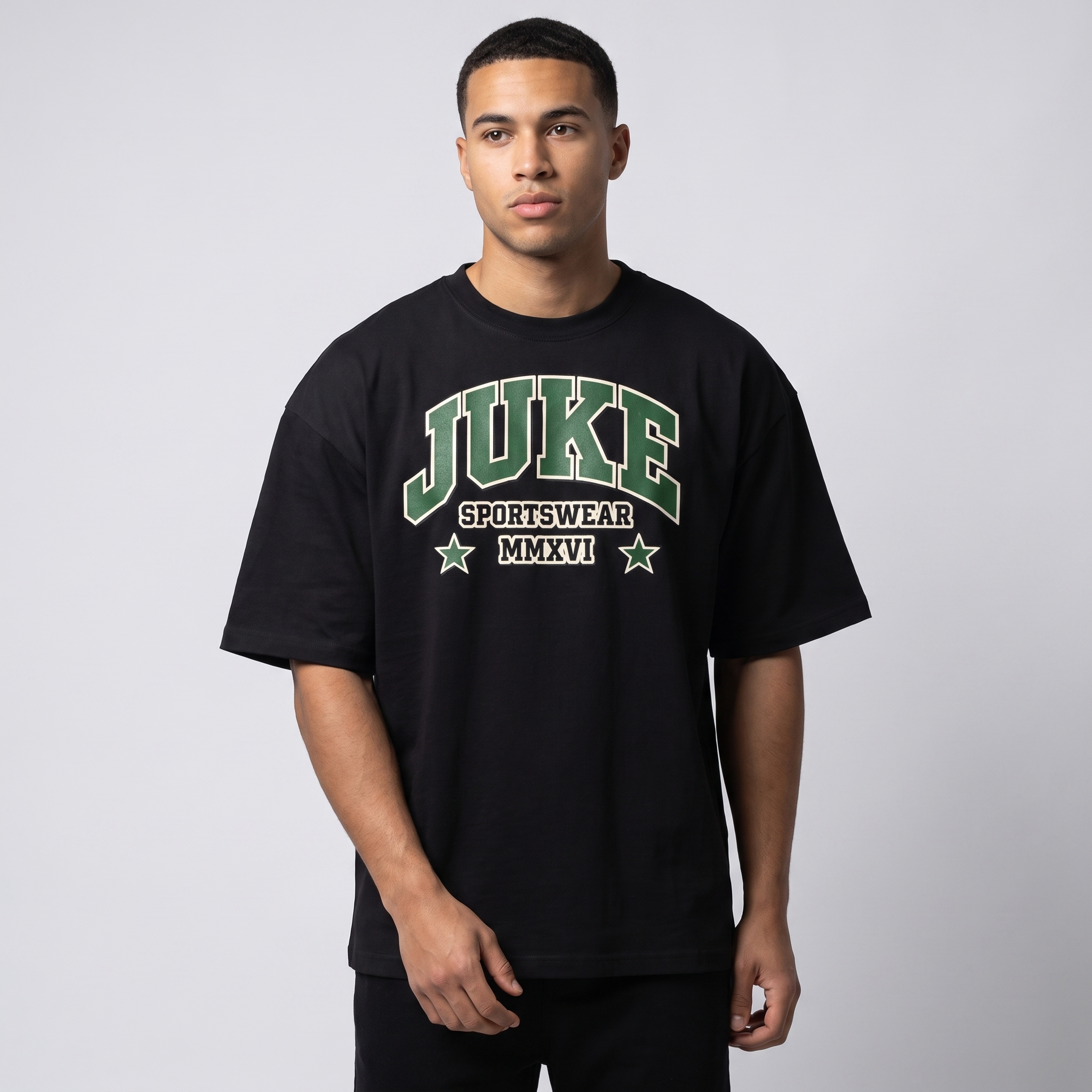 Model wearing the JUKE Unisex Boxy Oversized T-Shirt, studio shot