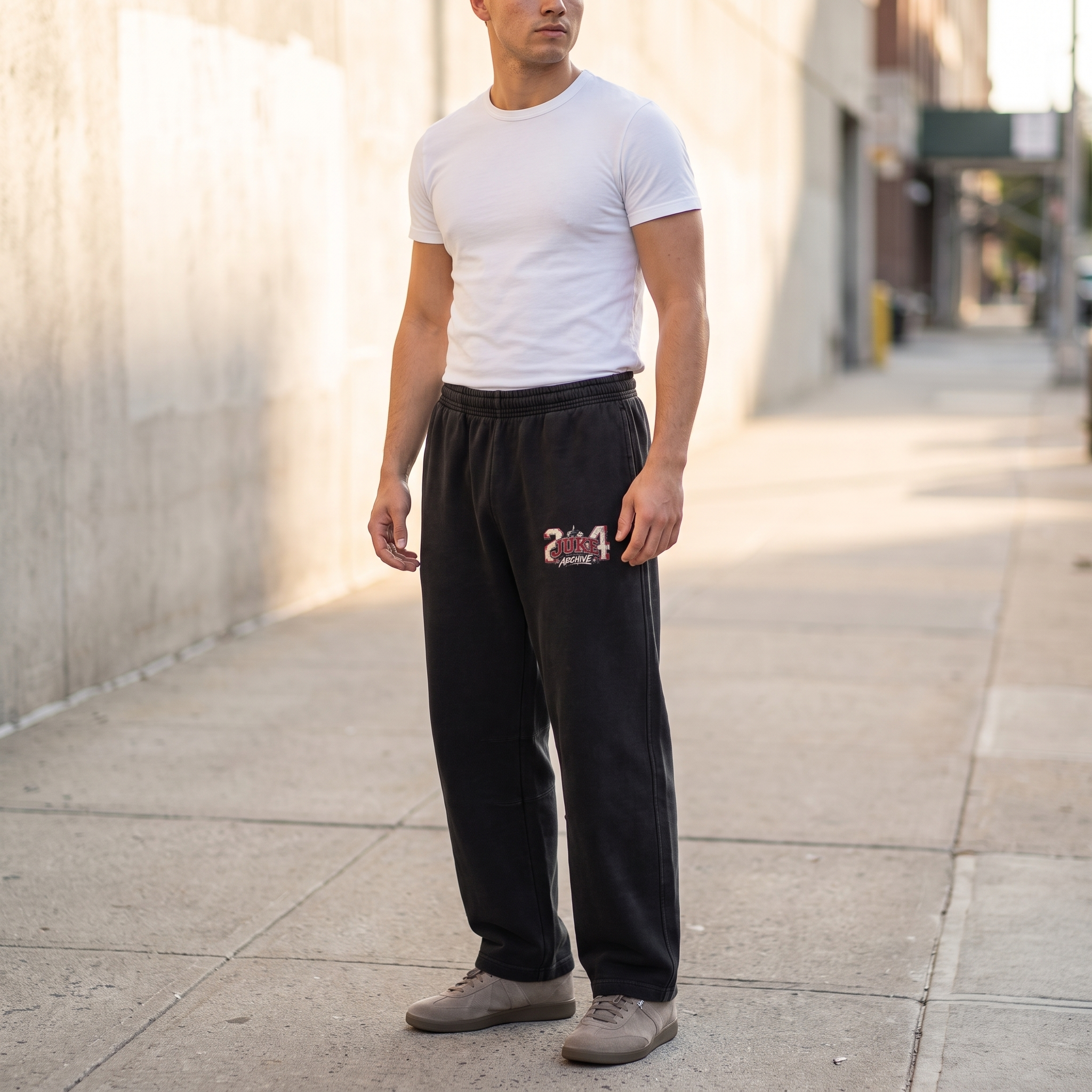 Model wearing the JUKE Unisex Vintage Washed Barrel Leg Sweatpants on a city street